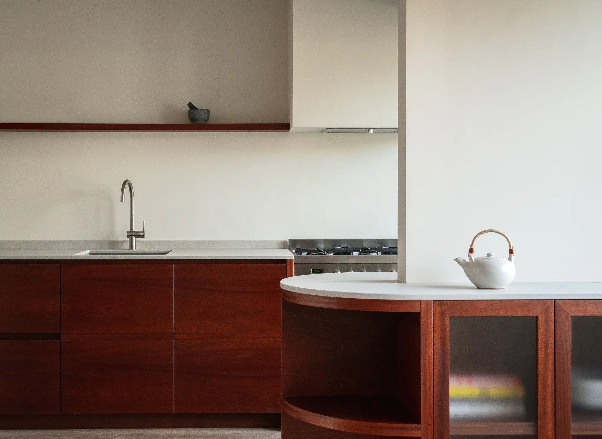 Kitchen island in mahogany with a honed limestone top, canal house, Amsterdam
