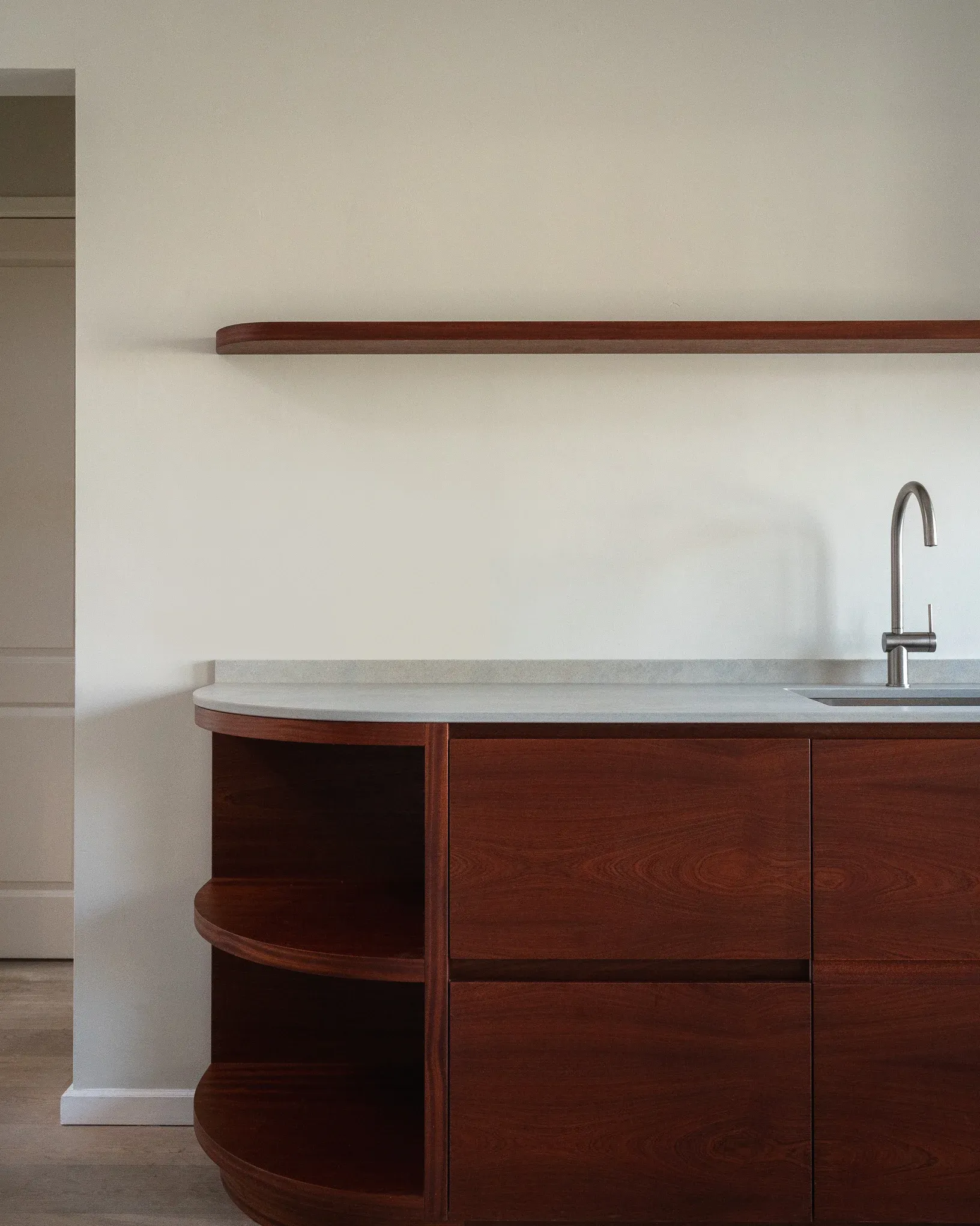 Kitchen island in mahogany with a honed limestone top, canal house, Amsterdam